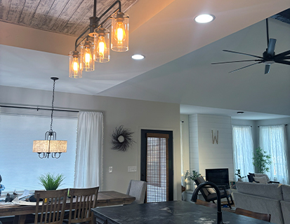 Open-concept kitchen and dining area with dark wood island in a Dublin, OH home renovation