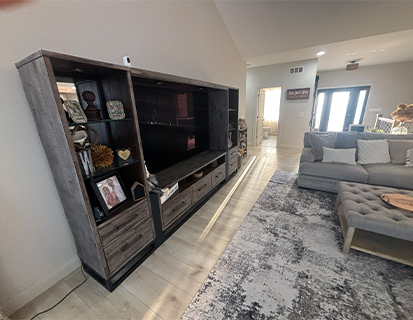 Custom entertainment wall with shelving in a Dublin, OH living room remodel