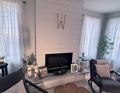Living room with fireplace feature wall in a Dublin, OH remodel