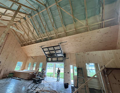 Large post-frame interior with vaulted wood ceiling in Marysville, OH construction project
