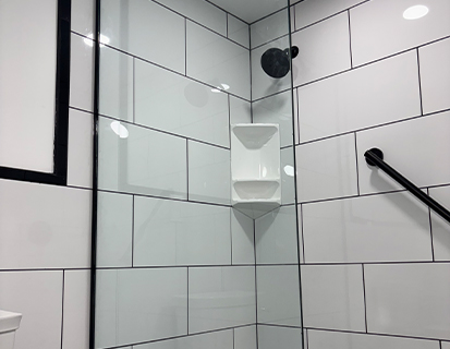 White subway tile shower with glass enclosure in Columbus, OH bathroom update