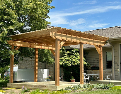 Wood pergola installation over backyard patio in Plain City, OH