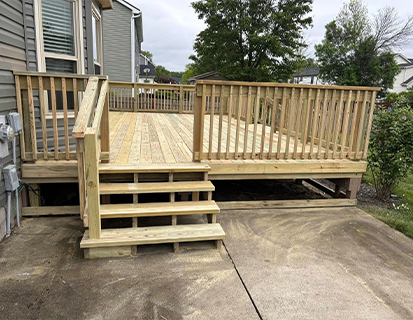 New backyard deck with railing and stairs in Grove City, OH