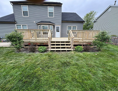 Elevated wood deck addition behind home in Grove City, OH residential project